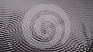 Monochrome black smooth water surface with sound wave circles, abstract background, wallpaper template.