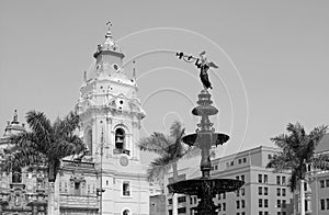 Monochrome Bronze Statue of the Fountain on Plaza Mayor Square with Basilica Cathedral of Lima in Background, Lima, Peru
