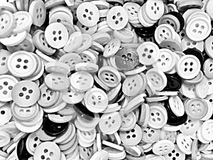 Monochrome disorderly small sewing buttons background