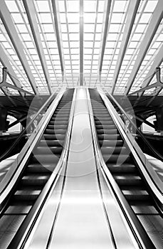 Monochrome escalator in futuristic interior