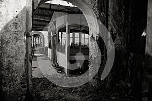 Monochrome image of dilapidated vintage corridor in the abandoned tin mining town of Jalan Papan in the outskirts of the city of P