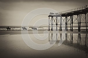 Monochrome image of horses on shoreline at Saltburn-by-the-Sea