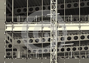 Monochrome image of a large construction site with steel framework and girders with fences and building hoist