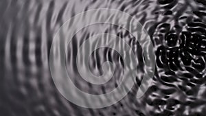 Monochrome light water surface, creating circles and big swirls under ultra sound vibrations, abstract background.