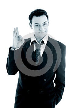 Monochrome picture of friendly businessman showing ok sign