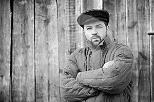 Monochrome portrait of bearded men in old-fashioned clothes, caucasian man 35 years old