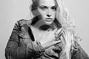 Monochrome portrait of blond woman.beautiful girl in jeans