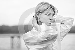 Monochrome portrait of woman of last century at autumn day