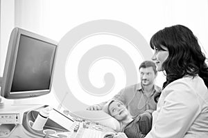 Monochrome shot of a loving pregnant couple at the hospital