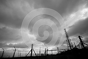 Monochrome silhouetted telecommunications mast