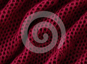 Textúra pletený tkanina tmavý ružový pletený trikot ako textilné tónovaný farba. bezšvový vzor. bezšvový 