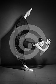 Monochrome vintage dramatic portrait of a dancing girl-ballerina