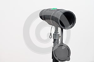 Monocular on a tripod isolated on a white field.