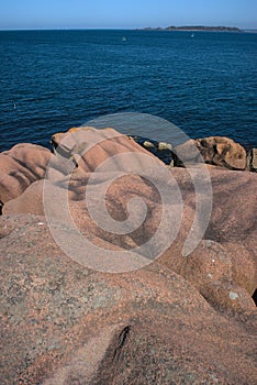 Monolithic blocks of pink granite in the Cotes d\'Armor in Brittany, France.