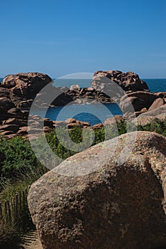 Monolithic blocks of pink granite in the Cotes d\'Armor in Brittany, France.