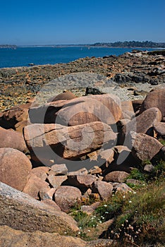 Monolithic blocks of pink granite in the Cotes d\'Armor in Brittany. Pink granite coast