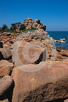 Monolithic blocks of pink granite in the Cotes d\'Armor in Brittany. Pink granite coast
