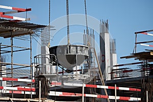 Monolithic construction of a multi-storey apartment building. Construction site. Construction in progress and concrete house frame