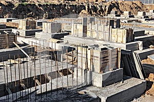Monolithic reinforced concrete foundation for the construction of a residential building. Rostverk at the construction site.