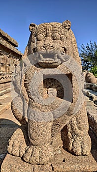 Monolithic stone carved lion sculpture