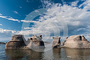 Monoliths on a cloudy sky in Mingan