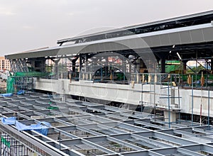 The monorail station is under construction in the suburb area