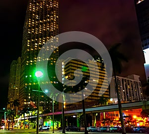 Monorail track and skyscrapers in downtown Miami at night