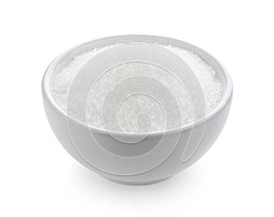 Monosodium glutamate in bowl on white background