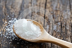 Monosodium glutamate MSG on wooden spoon