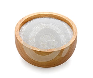 Monosodium glutamate in wooden bowl on white background