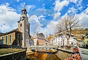 Monschau, Germany. Red house, city church on the Rur and fortification Haller on the hill photo