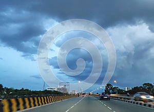 Monsoon clouds over a highway