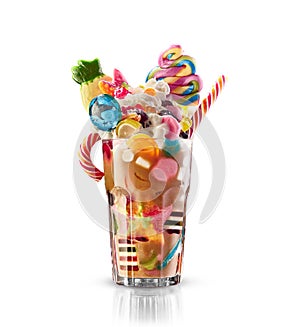 Monster shake, freak caramel shake . Colourful, festive milk shake cocktail with sweets, jelly. Colored caramel