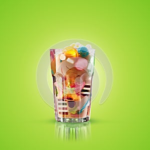Monster shake, freak caramel shake isolated. Colourful, festive milk shake cocktail with sweets, jelly. Colored caramel
