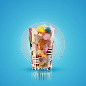 Monster shake, freak caramel shake isolated. Colourful, festive milk shake cocktail with sweets, jelly. Colored caramel