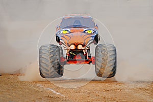 Monster truck coming out of the dust