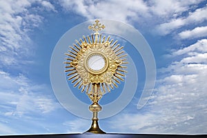 Monstrance - catholic religious symbol on blue background