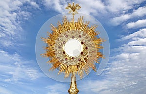 monstrance - catholic religious symbol on blue background