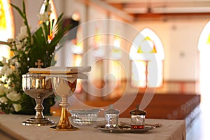 Monstrance and liturgical vessels in church background
