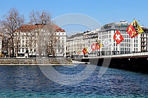 Mont Blanc bridge in Geneva, Switzerland. lakefront flags