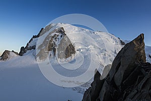 Mont-blanc du Tacul with a big rock view from The Cosmiques Hut in the French Alps, Chamonix-Mont-Blanc, France