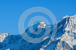 Mont Blanc du Tacul snow capped in Europe, France, Rhone Alpes, Savoie, Alps, in winter on a sunny day