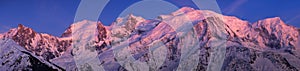 Mont Blanc Massif at twilight. Aiguille du Midi, Mont Blanc du Tacul, Mont Maudit, Dome du Gouter, Bossons Glacier. Haute Savoie