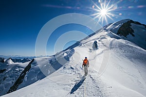 Before Mont Blanc Monte Bianco summit 4808m last ascending. Team roping up Man with climbing axe dressed high altitude