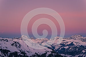 Mont Charvin left and the Aravis mountain range at sunrise or dawn, view from the top of MegÃ¨ve, Haute-Savoie, France