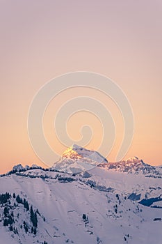 Mont Charvin right and the Aravis mountain range at sunrise or dawn, view from the top of MegÃ¨ve, Haute-Savoie, France