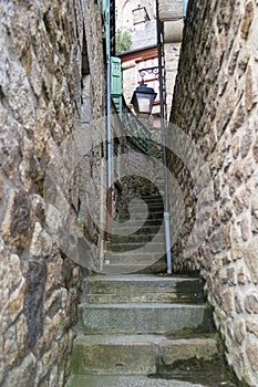 MONT SAINT-MICHEL, FRANCE - MARCH 27, 2016: Narrow stone streets