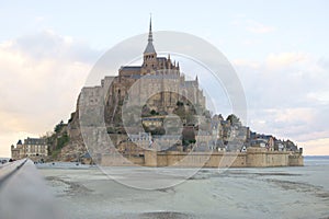 Mont Saint-Michel at sunset sky clouds twilight perspective walkway leading lines beautiful historical tourism northern france