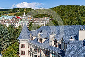Mont Tremblant, beautiful national park and village in harmony with nature, Tiled roofs of hotels. The unique and