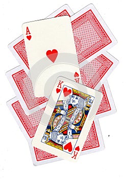 A montage of playing cards with a king and ace of hearts revealed.